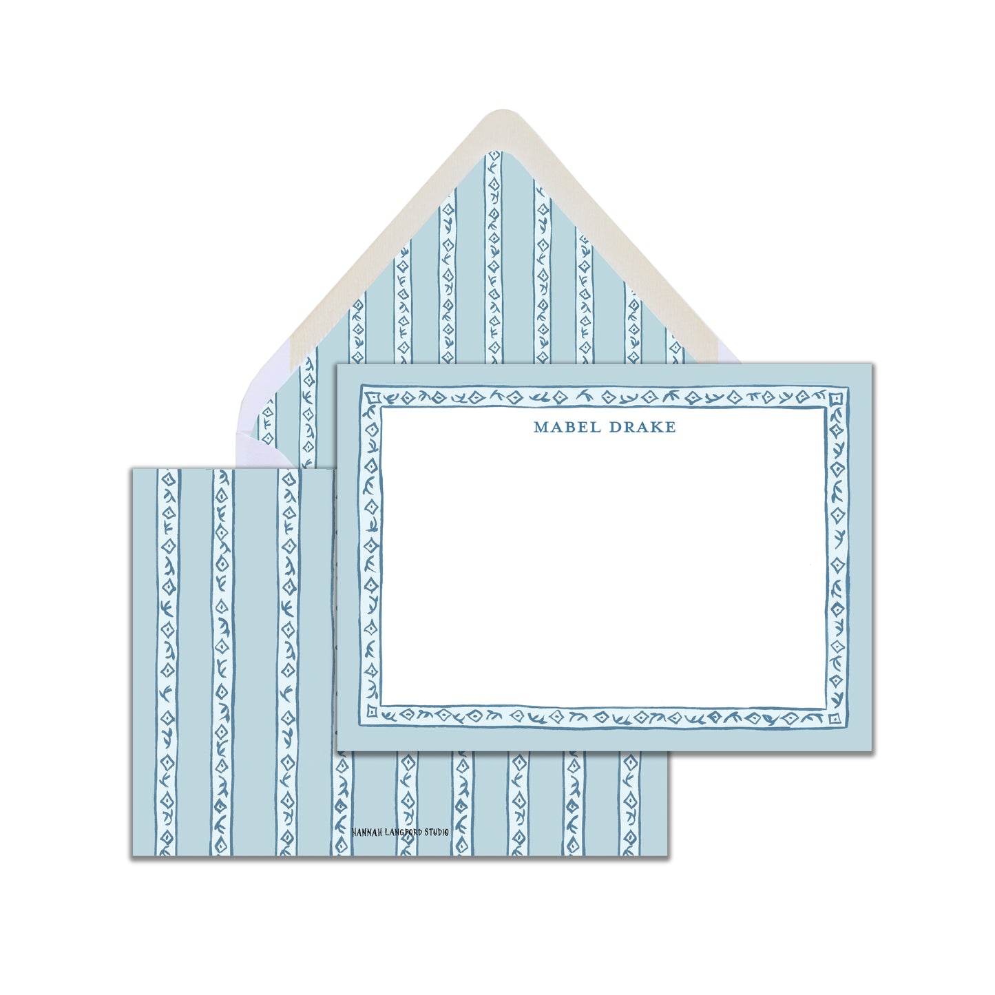 A set of blue and white block-printed stationery cards with a matching envelope, displaying a name personalization option.