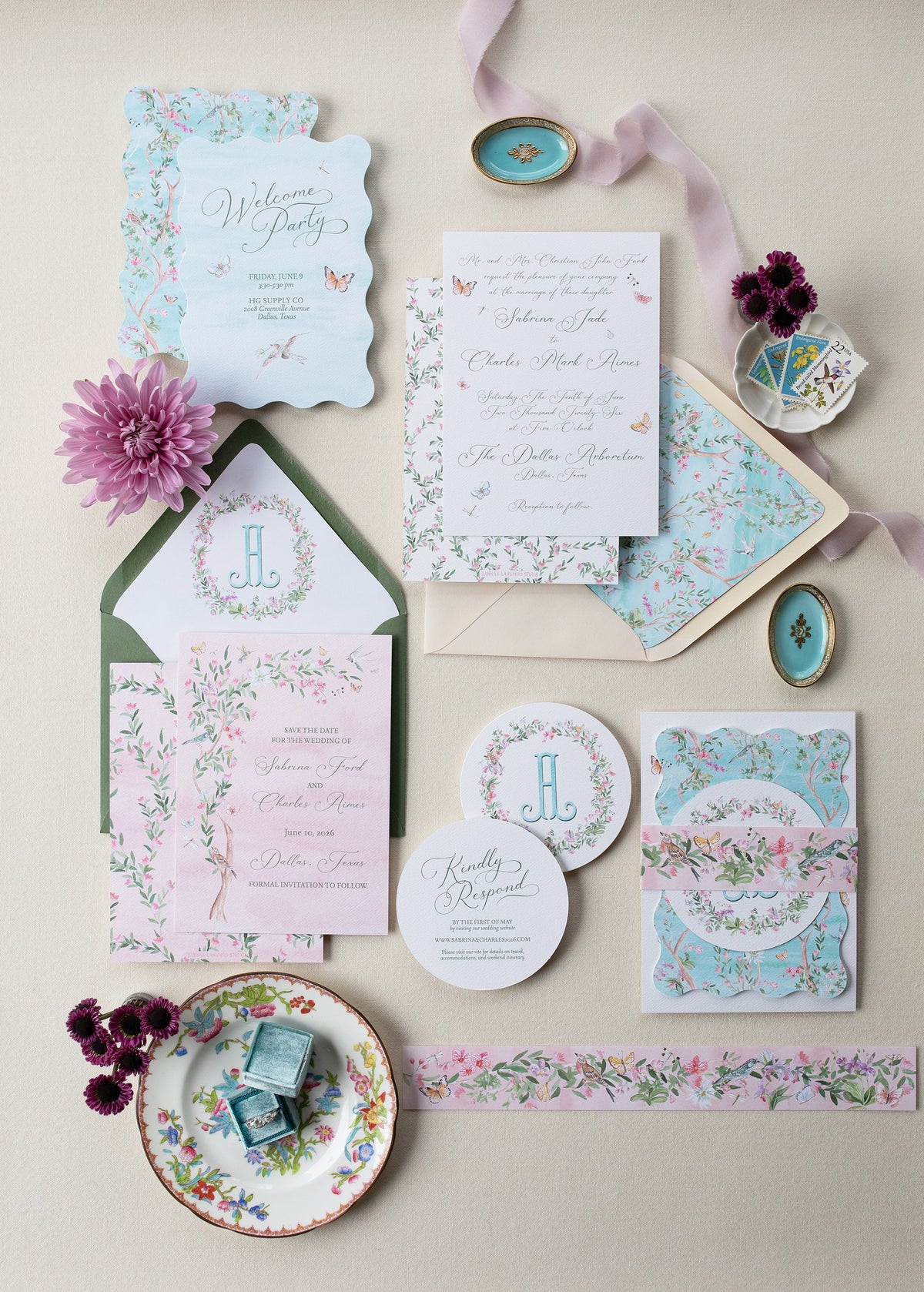 Floral wedding invitation set with matching stationery on a light background