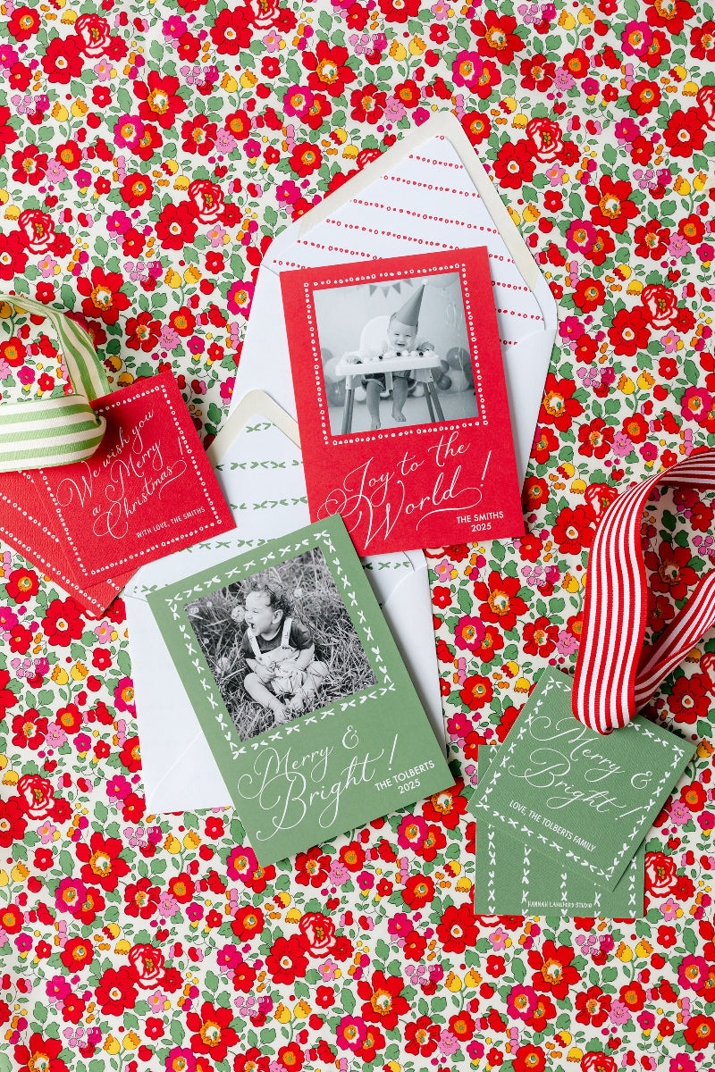 Holiday cards with envelopes on a floral background