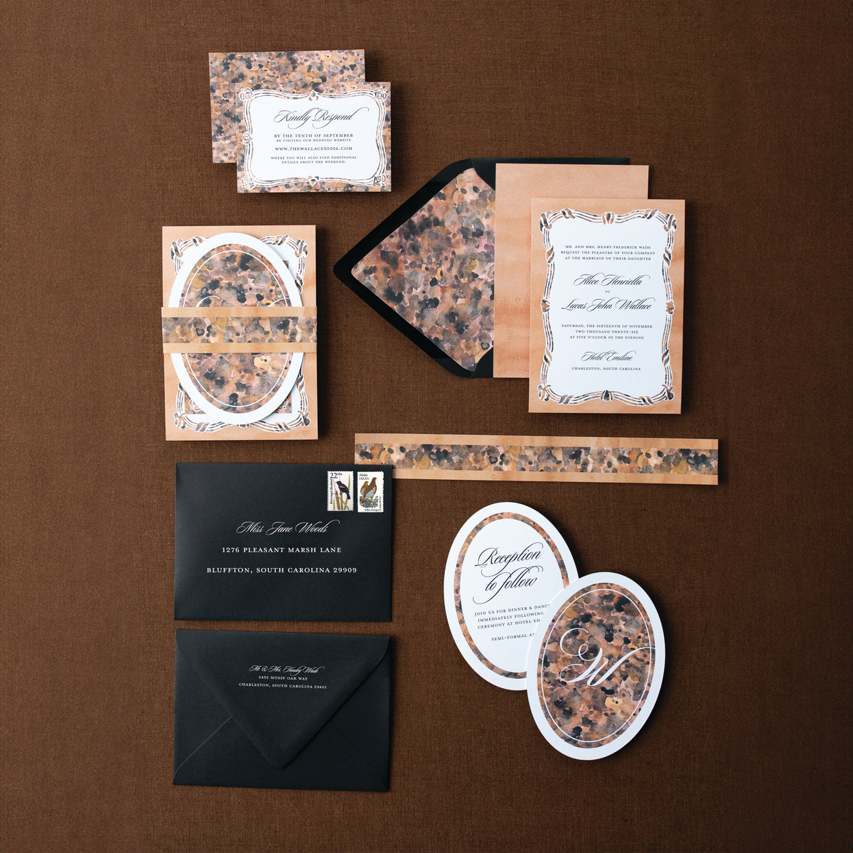 Collection of elegant stationery items on a brown background