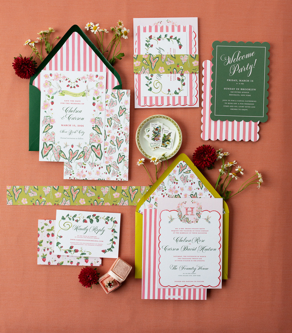 Collection of colorful party invitations and stationery items on a red background