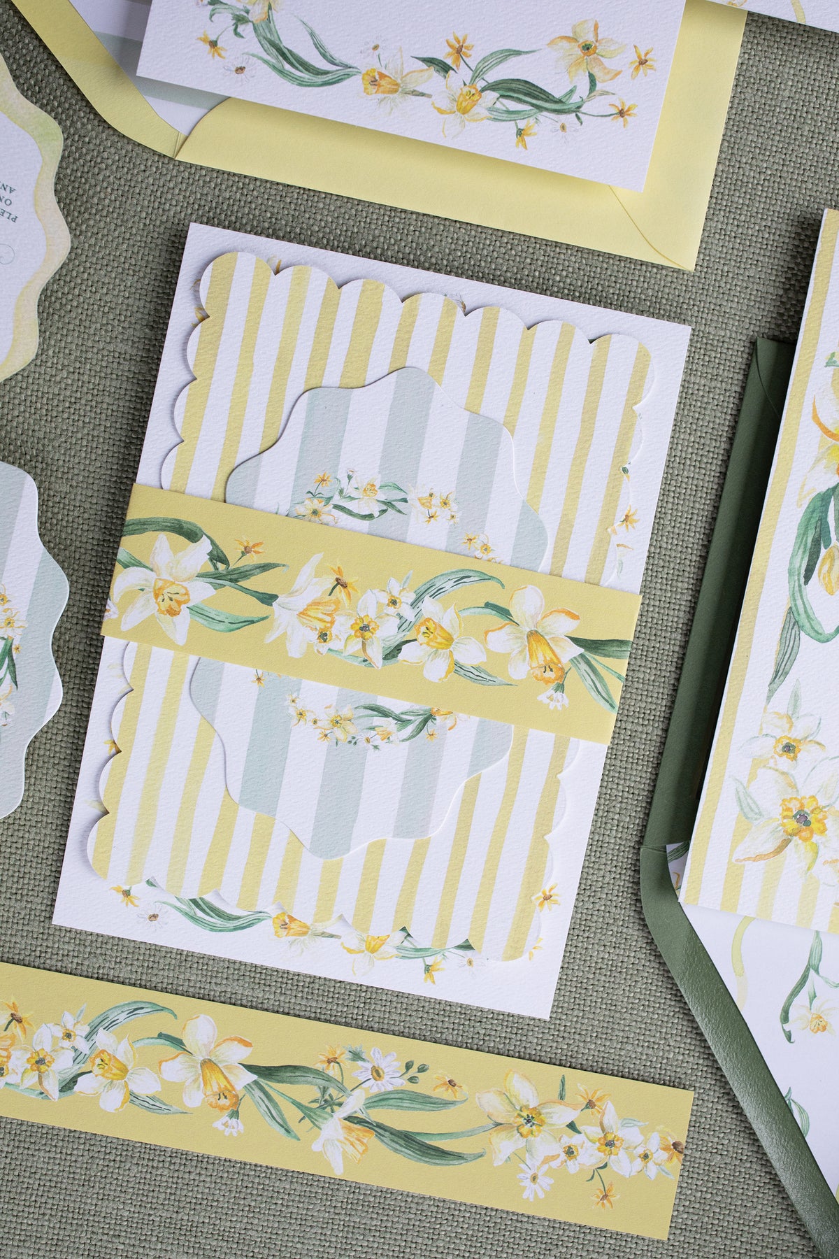Decorative paper with floral and striped designs on a textured surface