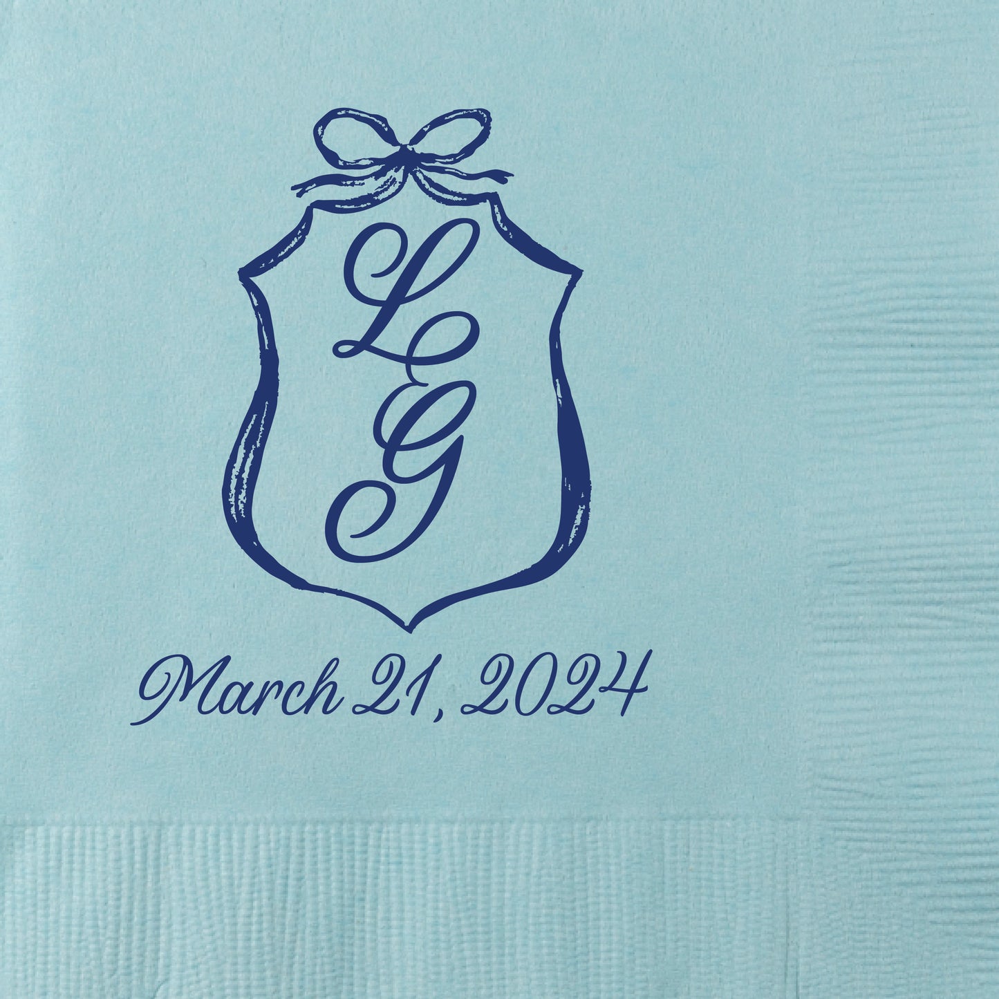 beverage napkins featuring a bow crest design