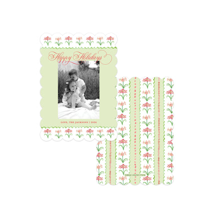A holiday-themed photo card set featuring a main card with a scalloped light green border, a black-and-white family photo, and red script reading 'Happy Holidays,' alongside several matching patterned cardstock strips on a white background.
