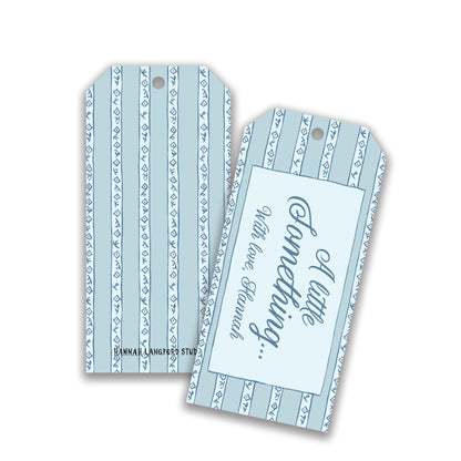 A set of two blue striped customizable gift tags with a printed message on one of them.