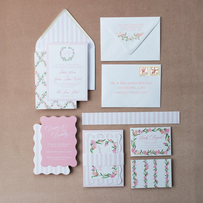 Set of wedding invitations and stationery items on a pink  background