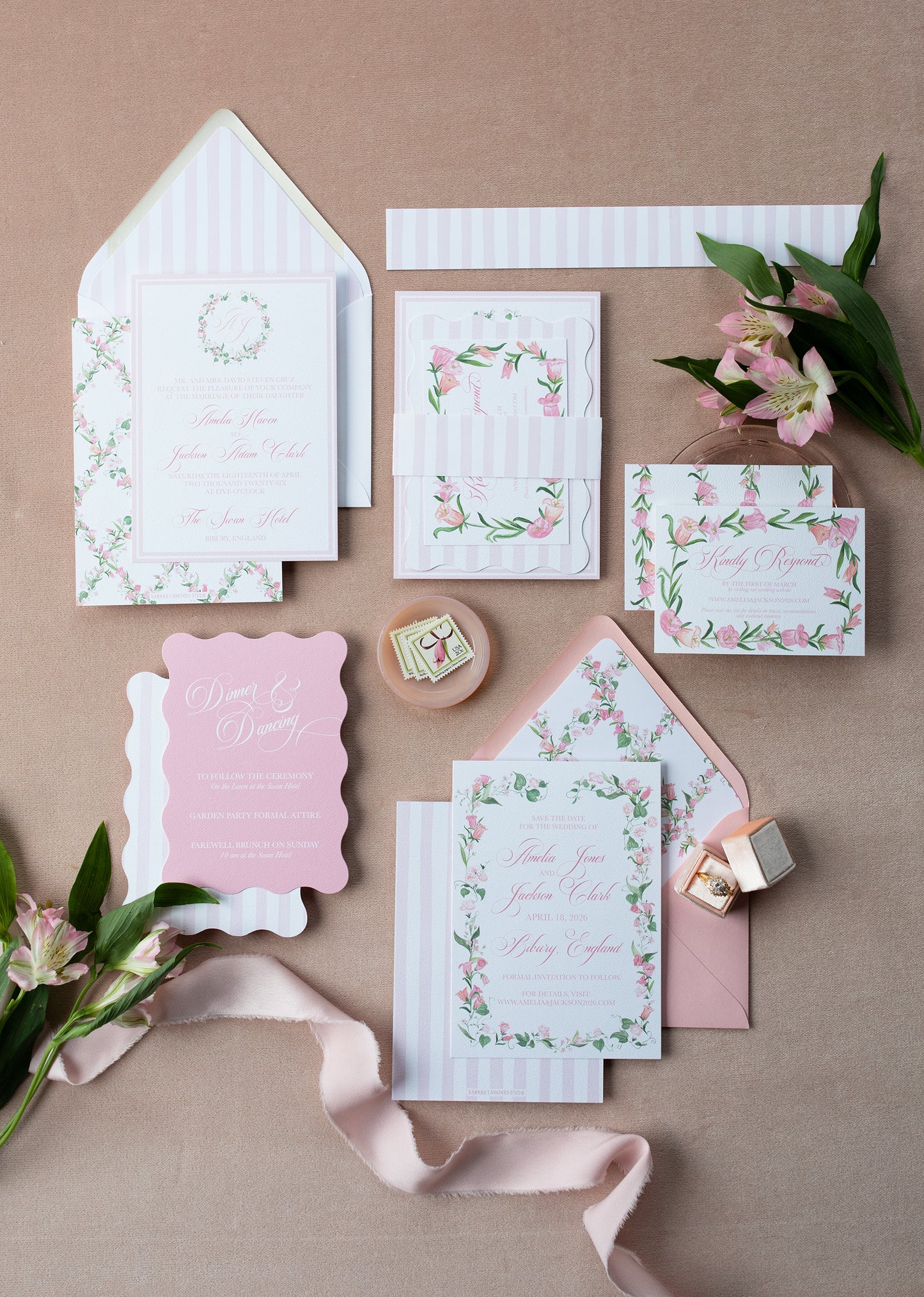 Set of floral stationery items on a pink background