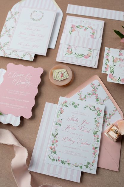 Set of floral stationery items on a pink surface