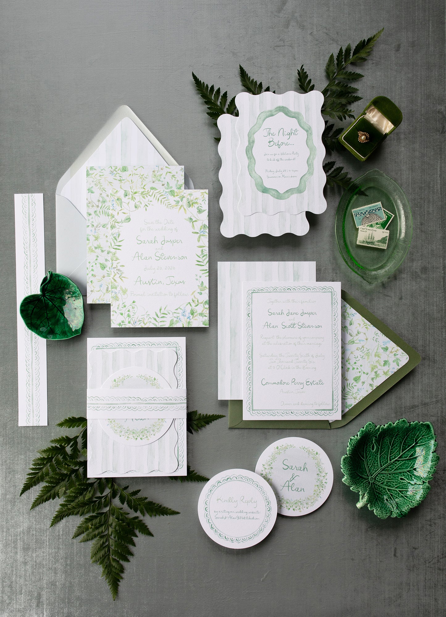Green and white invitation set with leaves on a gray background