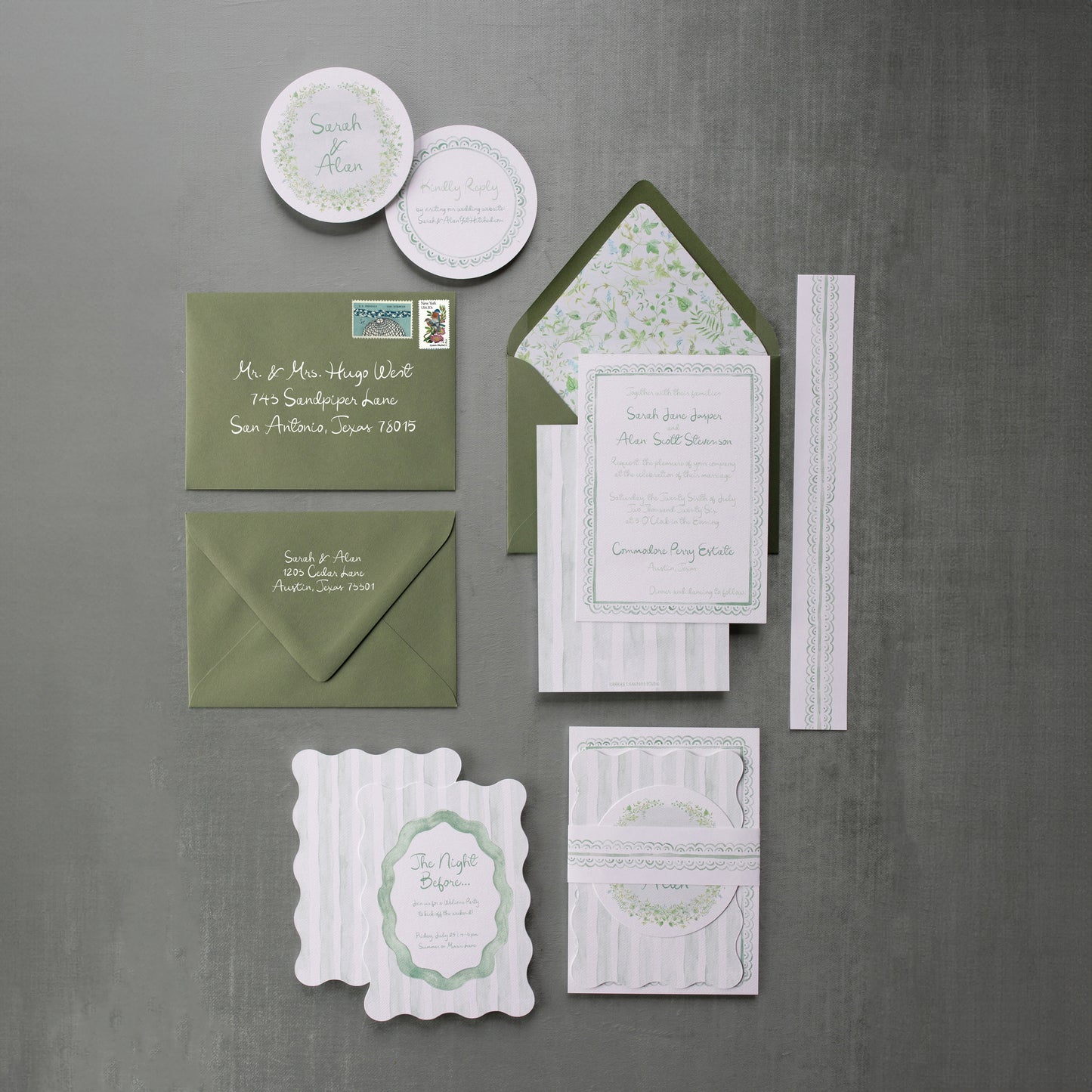 Collection of green and white stationery items on a gray background