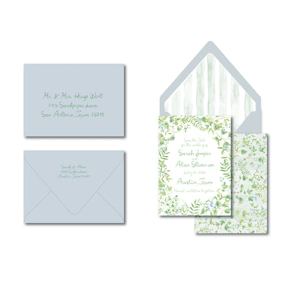 Blue and green invitation with greenery illustrations on a white background.
