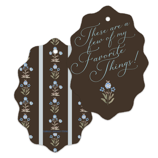 Decorative tag with floral designs and text on a white background
