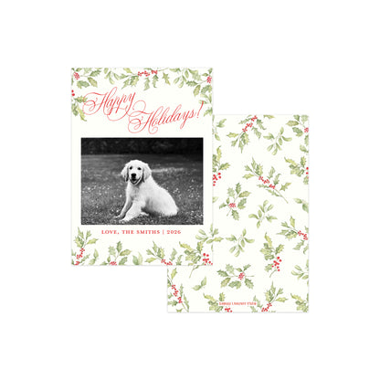 Two holiday greeting cards with a white background, decorated with a green holly and red berry floral pattern. 