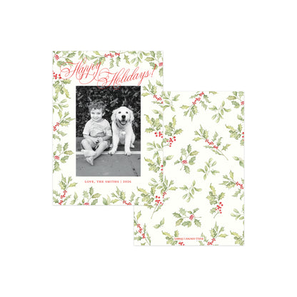Two holiday photo cards with a green holly and red berries pattern on a cream background.