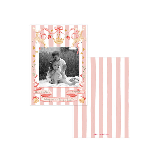 A pink and white striped Christmas card featuring reindeer and holiday motifs.