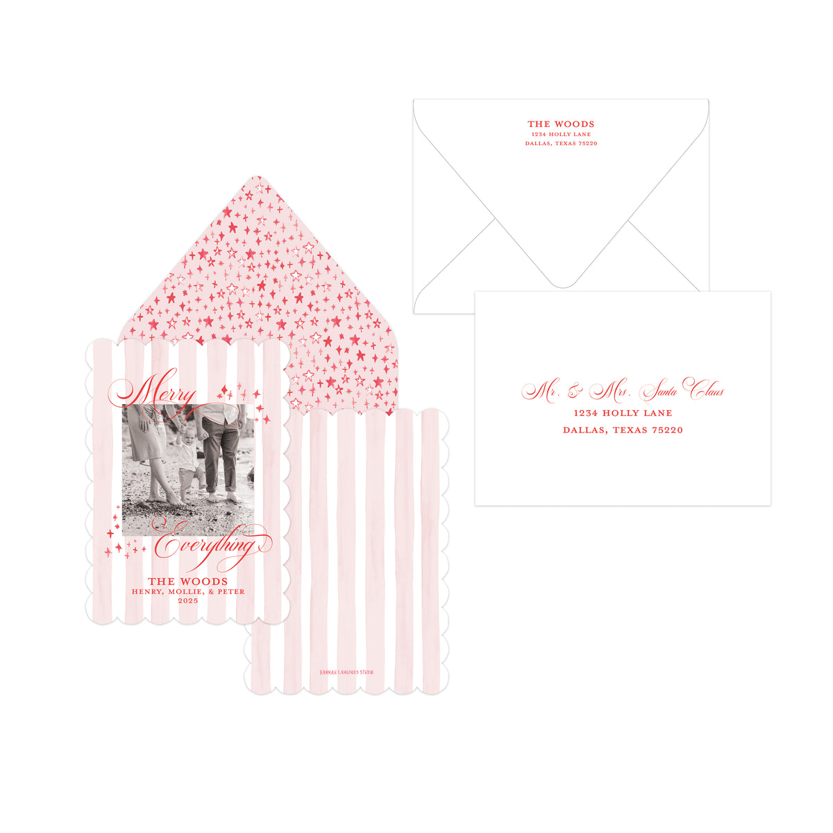 A holiday card collection featuring a scalloped invitation card with a black-and-white photo and pink text, a matching envelope with pink starry pattern, a white envelope, and a white envelope with pink script lettering, all arranged on a white background.
