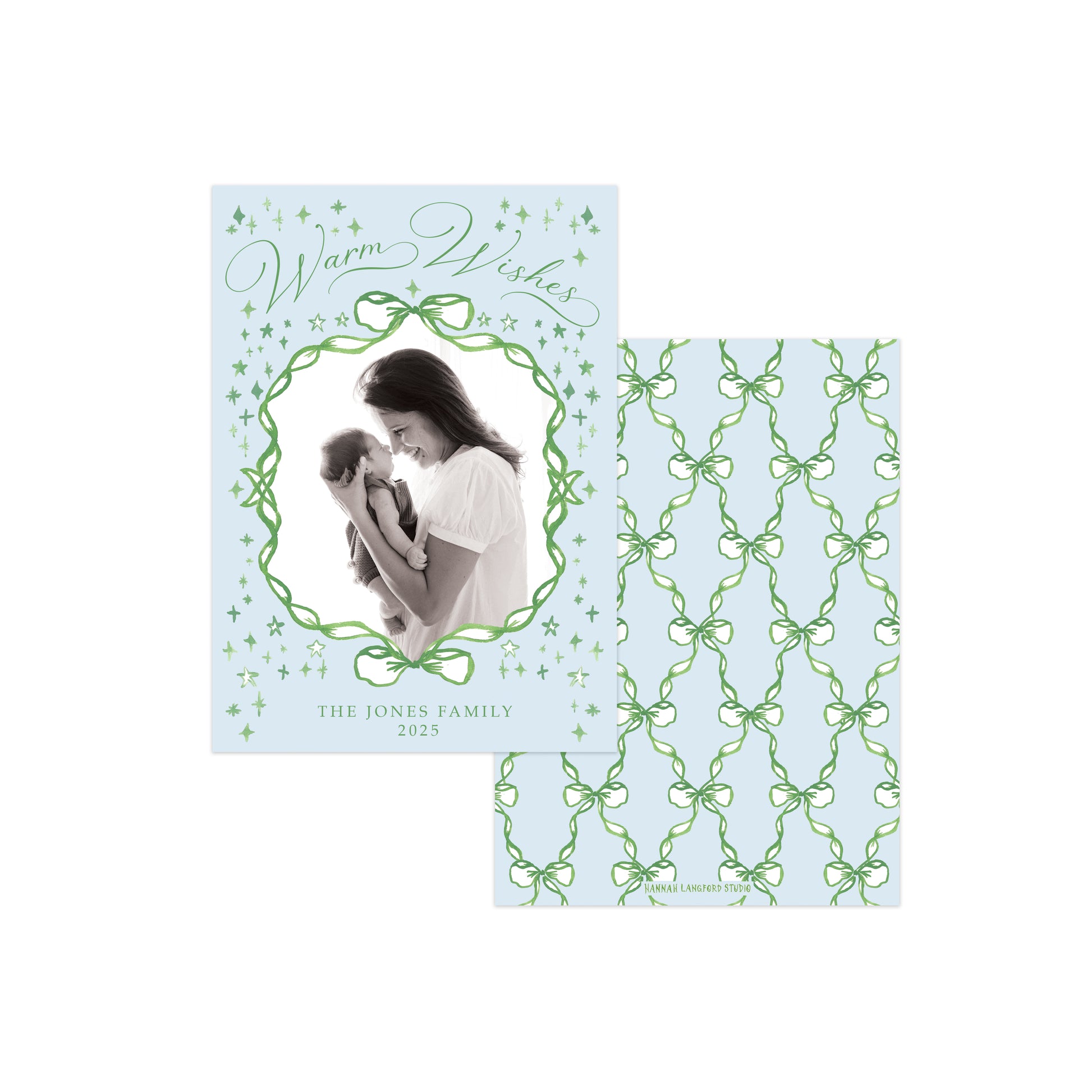 A personalized holiday greeting card set on a white background, featuring a front card with a photo of a woman and child inside a green vine border and the text 'Warm Wishes' and 'THE JONES FAMILY 2023', plus a matching back or insert with a green trellis pattern on a pale blue background.