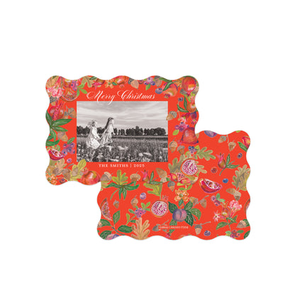 Two decorative scalloped photo frames with a bright red background and an allover botanical print of pomegranates, and leaves.