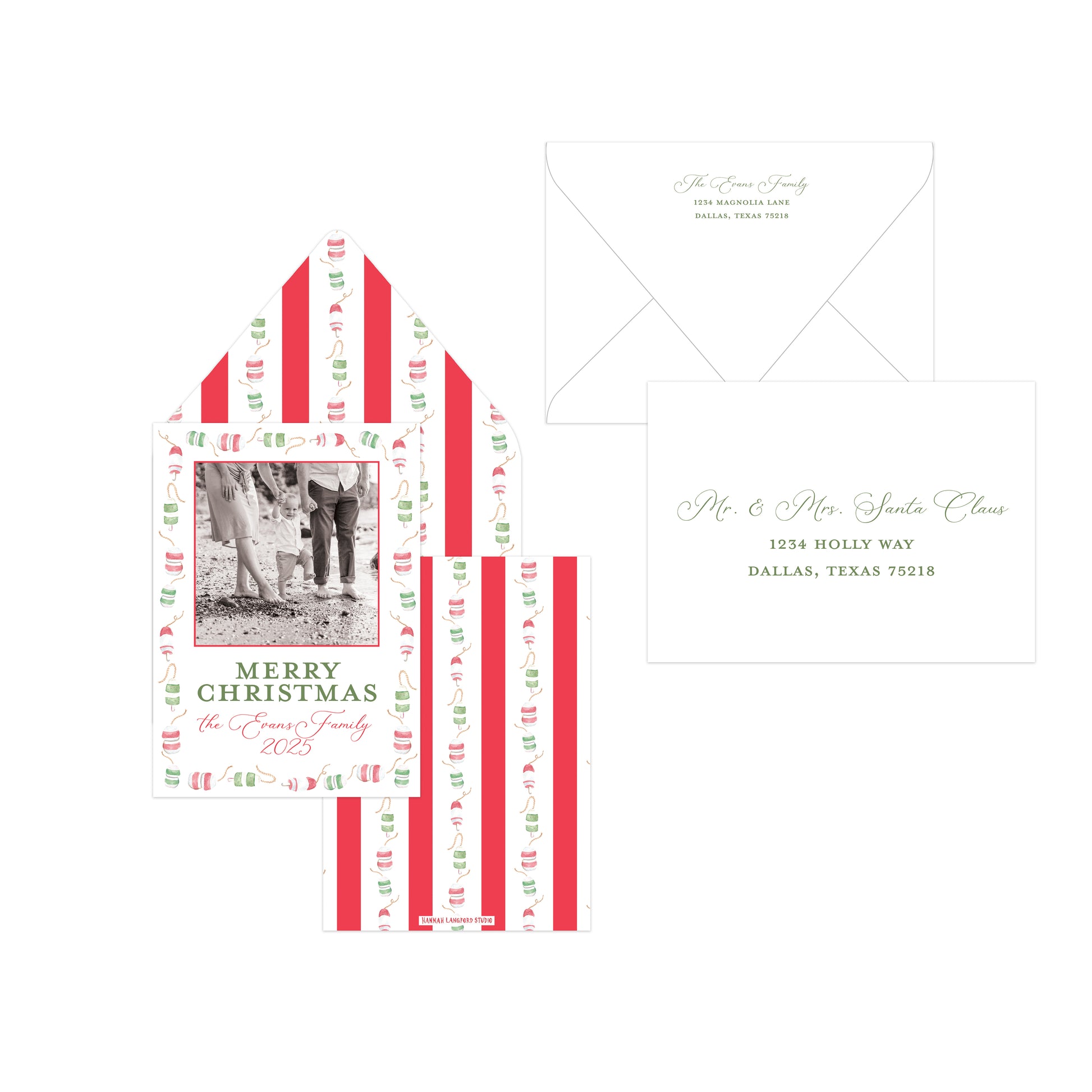 A holiday-themed stationery set featuring a personalized Christmas card with a photo placeholder, a matching striped envelope, and a white envelope with elegant script text, all arranged on a clean white background.