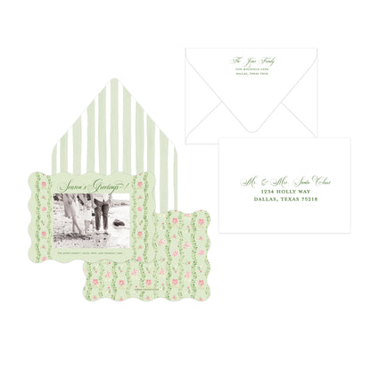 A Christmas card suite featuring a floral and striped envelope, a photo insert with the heading 'Season's Greetings!', and a matching address card on a white background.