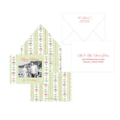 A holiday stationery set with green and red floral illustrations