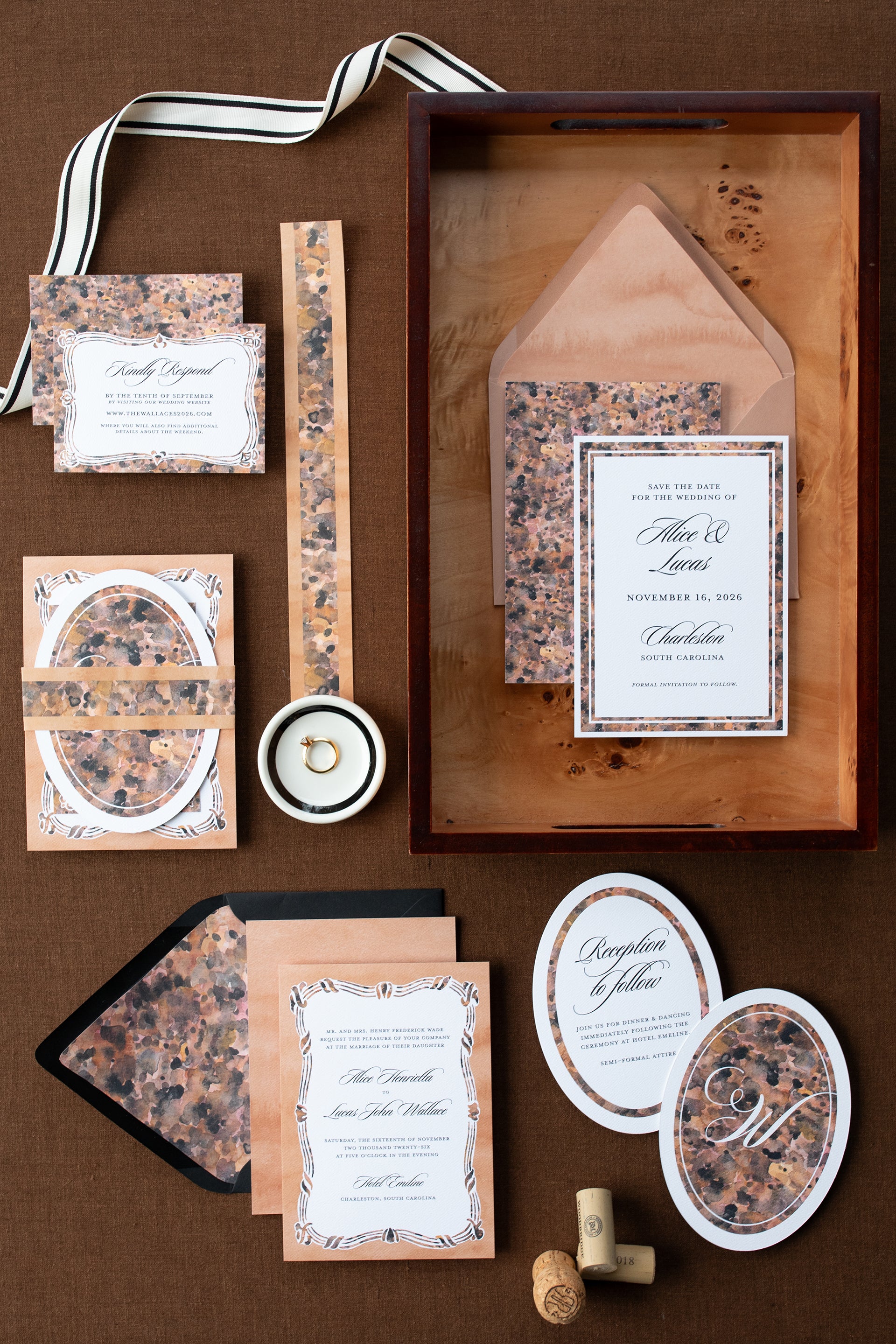 Wedding invitation set with floral design on a brown background