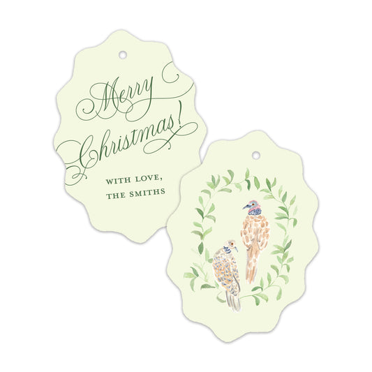 Two scalloped Christmas gift tags on a white background. 