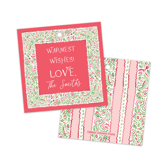 Two pink and green patterned gift tags on a white background, one showing the front with the text 'WARMEST WISHES! LOVE, The Smith' and the other showing the patterned back.