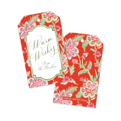 Two decorative gift tags with a red floral pattern and green script text reading 'Warm Wishes From the Burkes' on a white background.