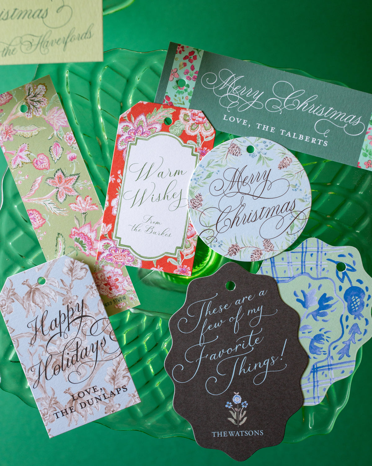 Colorful gift tags on a green background.