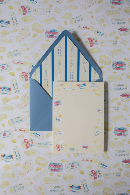 stationery cards with butter illustrations on a patterned background