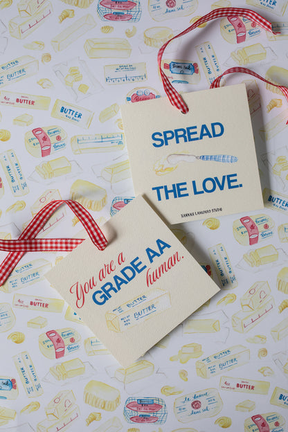 gift tags featuring butter illustrations on a butter patterned background