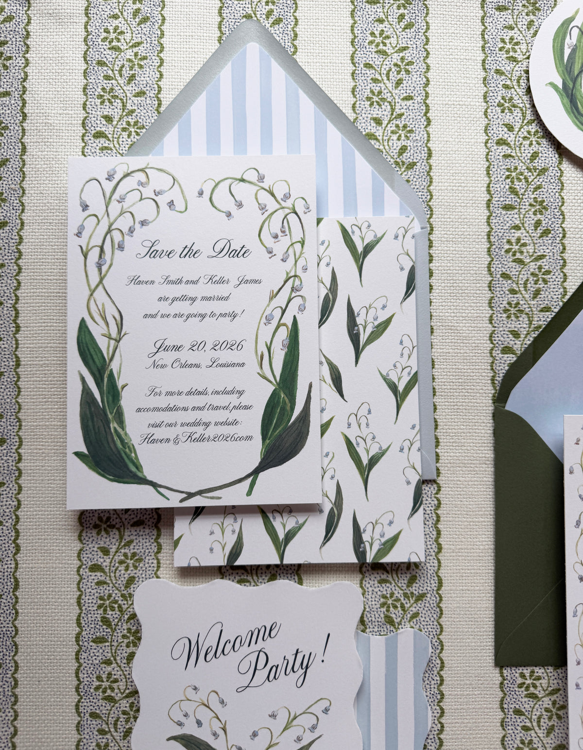 Wedding invitation set with floral design on a textured background