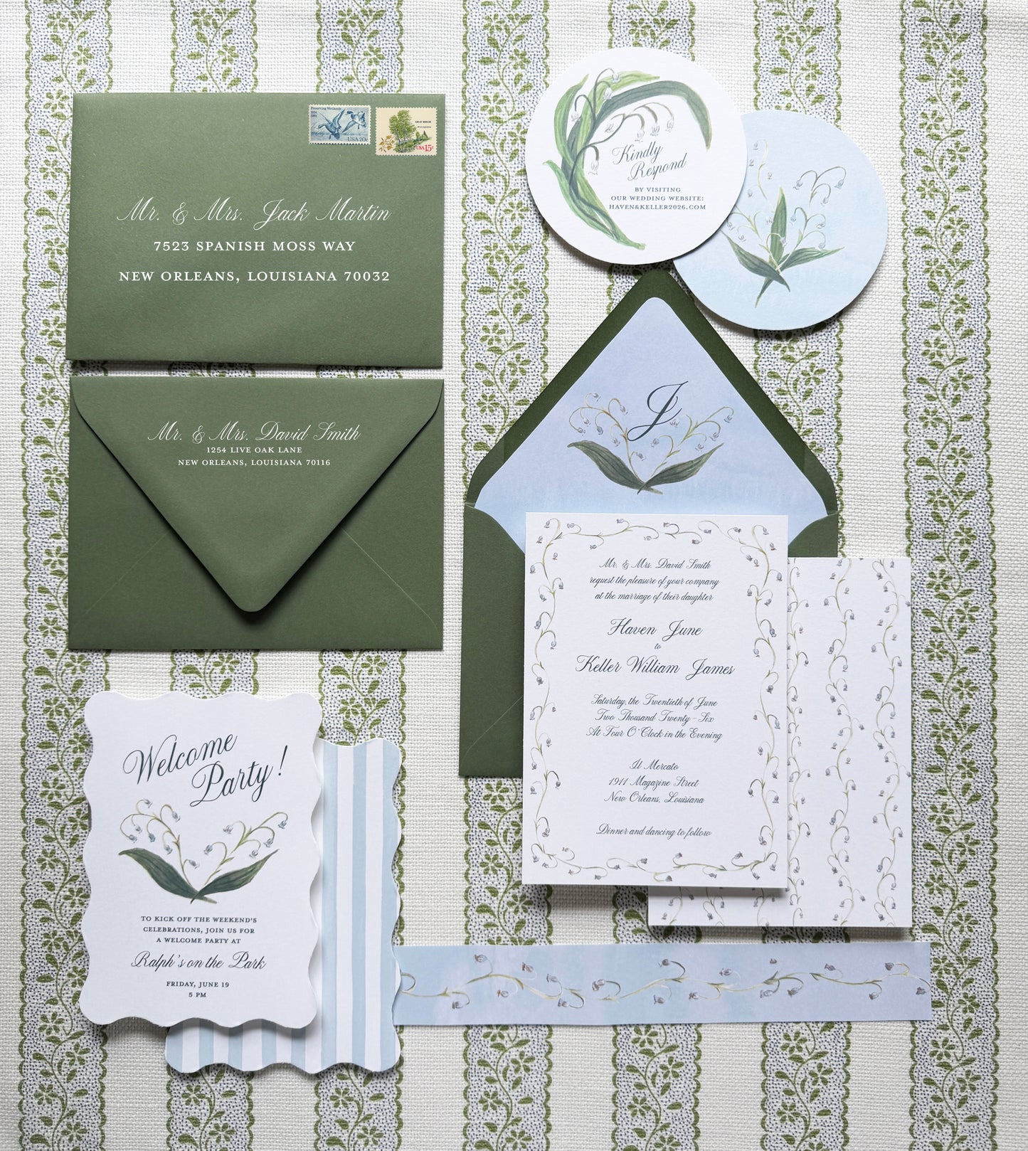 Wedding invitation set with green and white design on a patterned background