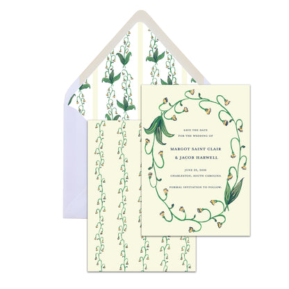 Wedding invitation set with green floral design on a white background