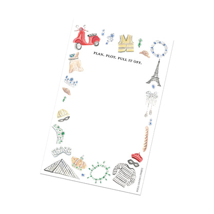 notepad with French-themed illustrations.