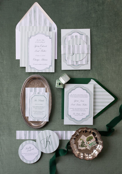 Collection of elegant stationery items on a green background