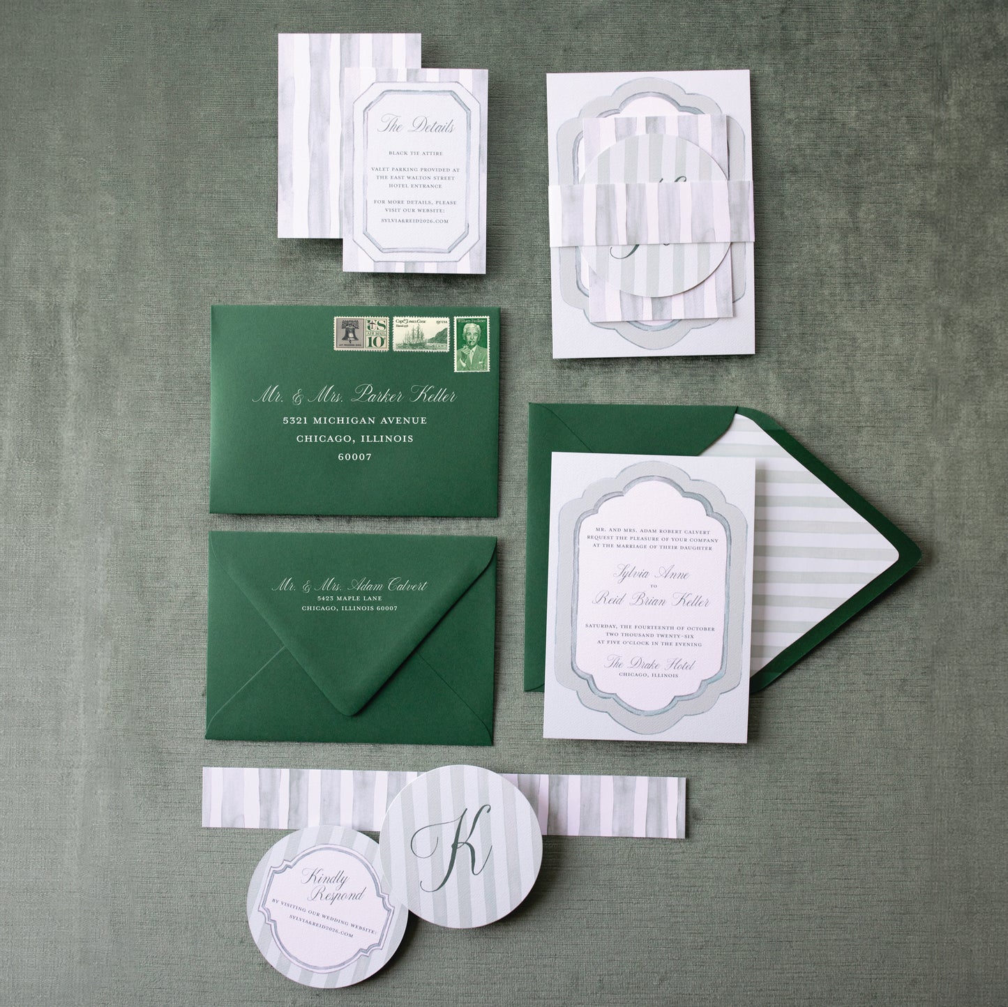 Green and white wedding invitation set on a green textured background