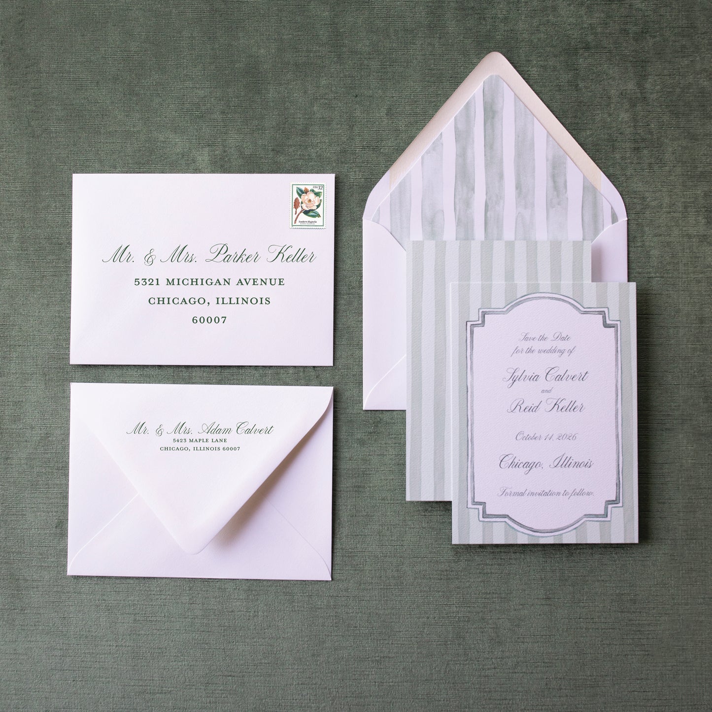 Wedding invitation set with envelopes on a green textured background