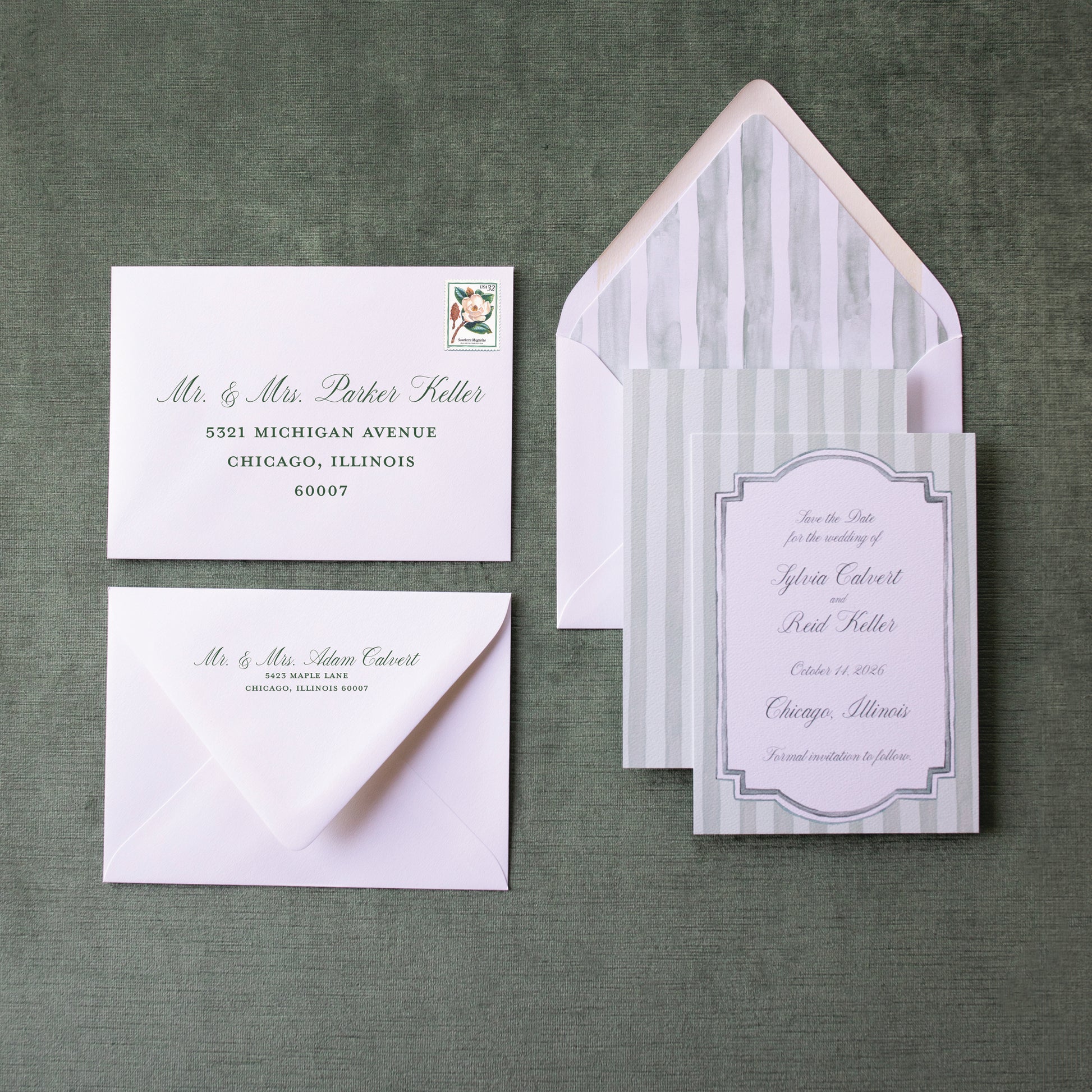 Wedding invitation set with envelopes on a green textured background