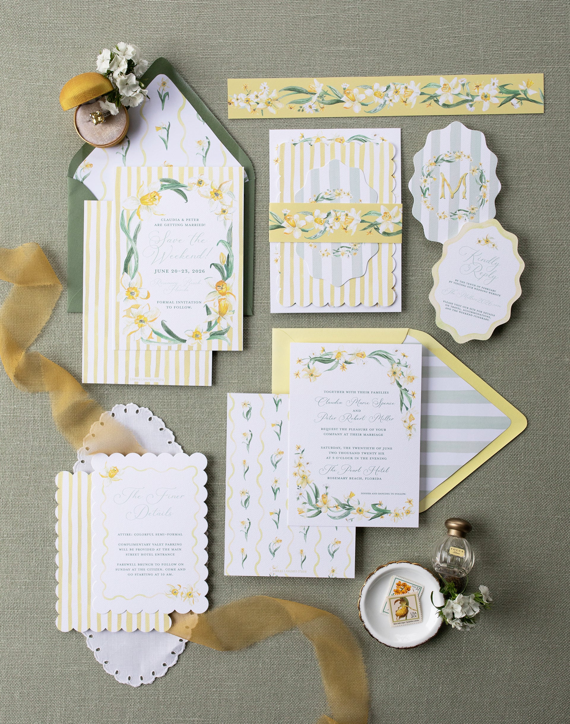 Wedding invitation set with floral designs on a textured surface