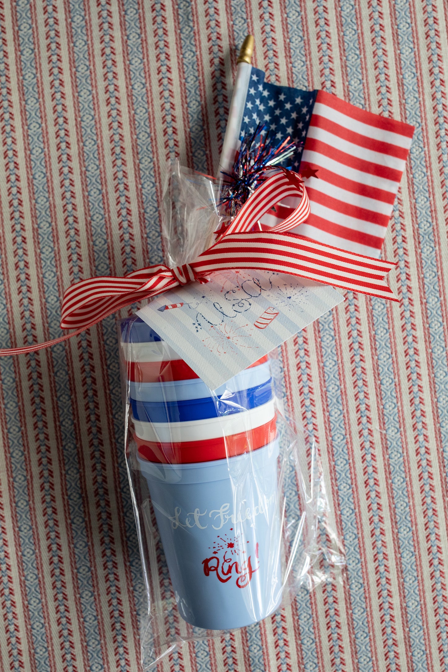 Decorative item with American flag design on a striped background