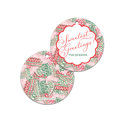 Two circular coasters with decorative patterns and 'Sweetest Greetings' text on a white background.