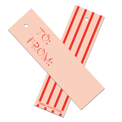 Two pink gift tags with red text and stripes on a white background