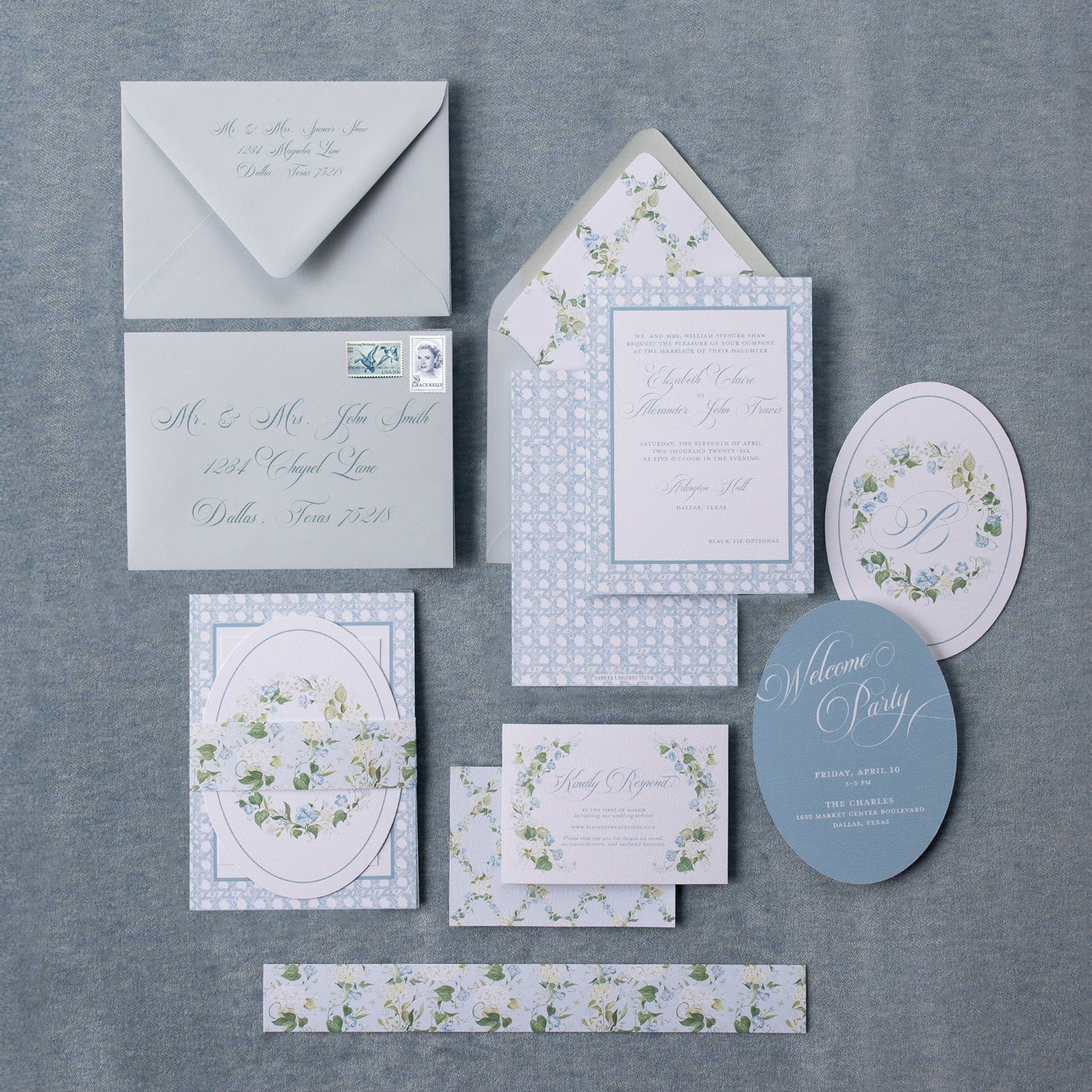 Blue floral wedding invitation on a blue background