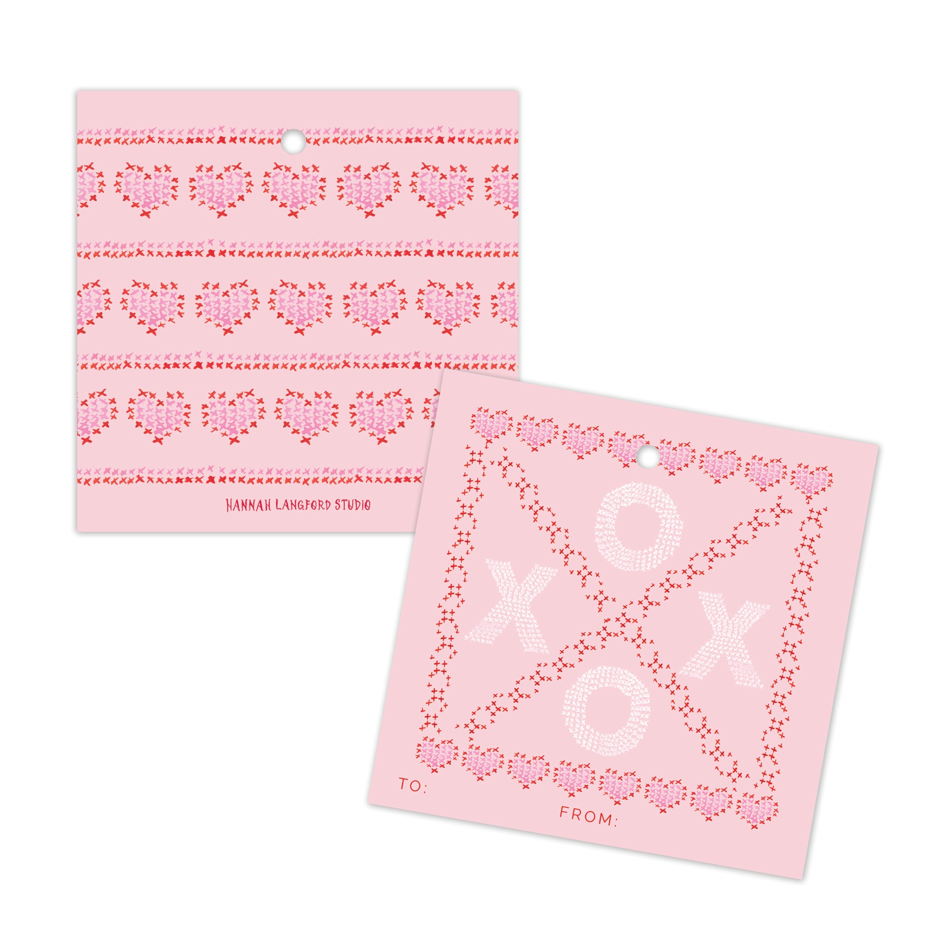 Two pink cards with heart patterns on a white background