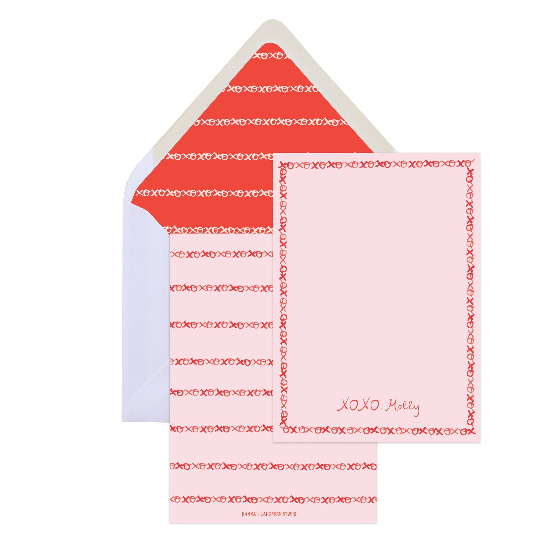 Set of stationery items with pink and red design on a white background