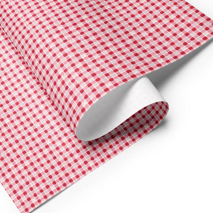 wrapping paper with a red and pink gingham pattern.