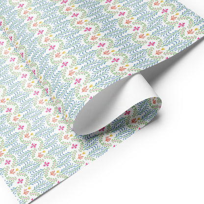 A sheet of colorful, Mexican-inspired wrapping paper with floral illustrations.