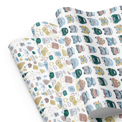 three sheets of wedding-themed wrapping paper.